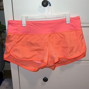 lululemon athletica pink and orange speed up shorts! size 6 2.5” inseam